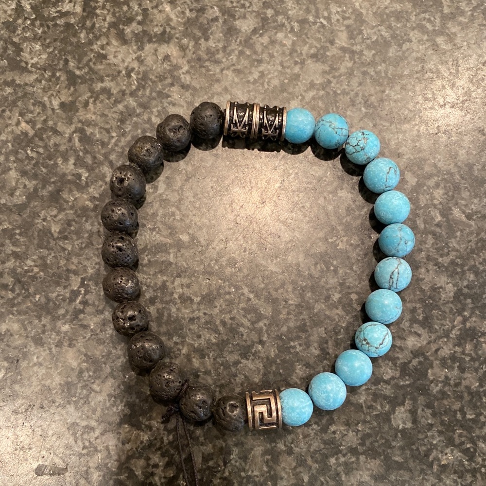 Axion mens turquoise, silver and black lace bracelet.  Opens at silver